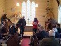 G23.1 Jane Batchelor  chair of the Burkes Pass Heritage Trust introduces the author to meeting at St Patricks church  Jared Griffith photo 